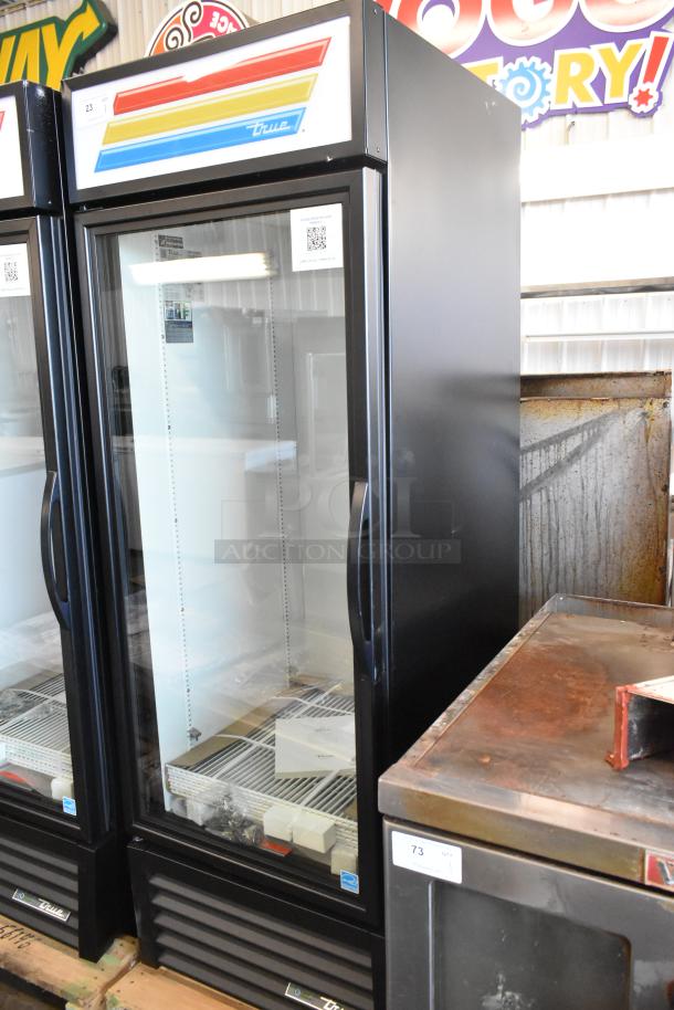 Brand new 2025 True GDM-23-HC metal commercial single door cooler, with poly coated racks, 115V, minor scratches visible.
