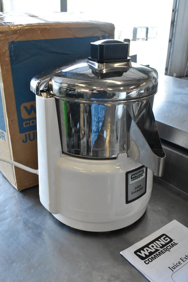 Brand new Waring 31JE27 metal countertop juice extractor, 120 volts, 1 phase. Scratch and dent model, white and silver finish.