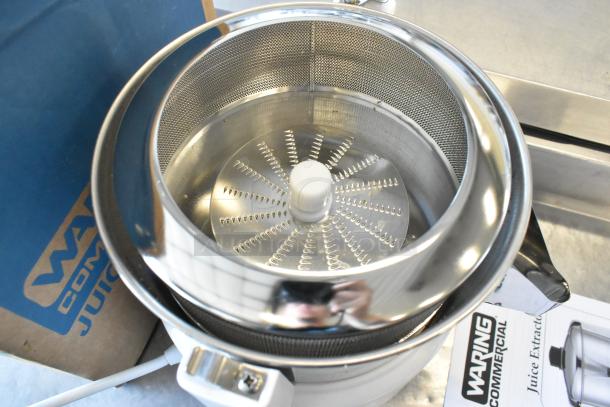 Waring 31JE27 Metal Juice Extractor, brand new, minor scratches. Includes box. 120V, 1 Phase, countertop model.