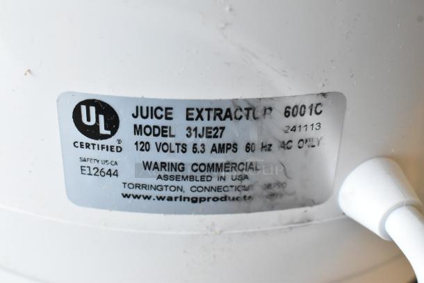 Waring 31JE27 metal juice extractor label showing UL certification, 120 volts, 5.3 amps, 60 Hz, made in USA.