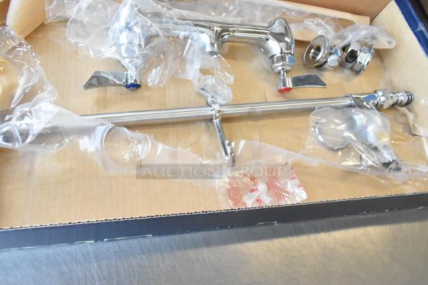 Brand new Waterloo 750PRW816 wall-mounted pre-rinse faucet with 8" centers, 16" add-on faucet, in packaging.