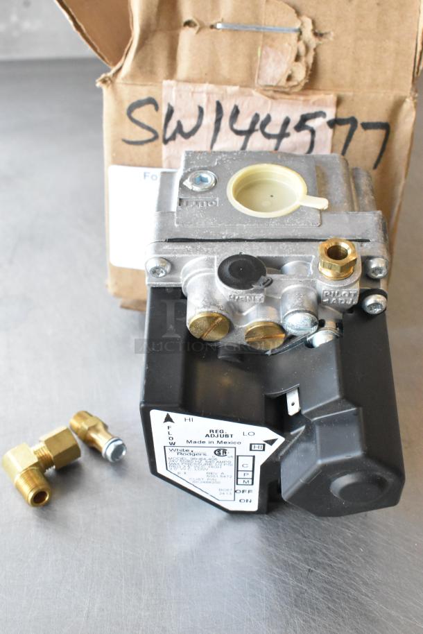 Brand new Cleveland KE003671-1 replacement valve, scratch and dent condition, with original packaging and fittings shown.