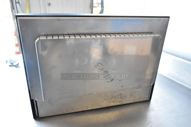 Brand new commercial metal door with visible scratches and dents; marked with "619619" on surface.