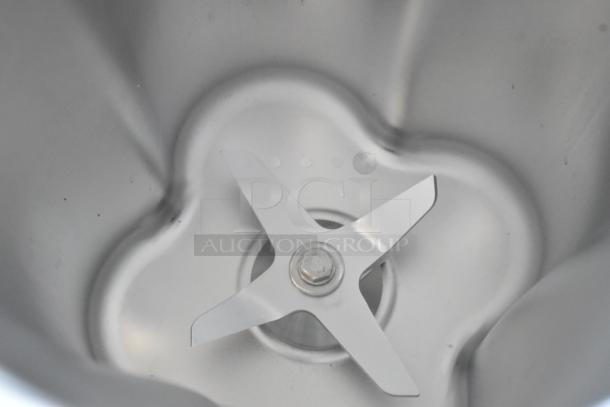BRAND NEW AvaMix stainless steel blender pitcher, scratch and dent, no lid, visible blades, suitable for blending.