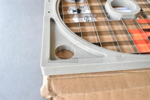 BRAND NEW SCRATCH AND DENT! AvaMix 177CDICE2532 25/32" dicing grid, visible top corner with wire grid and plastic frame.