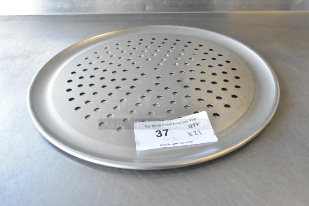 Brand new scratch and dent metal round perforated baking sheet, with quantity label, auction item 37.