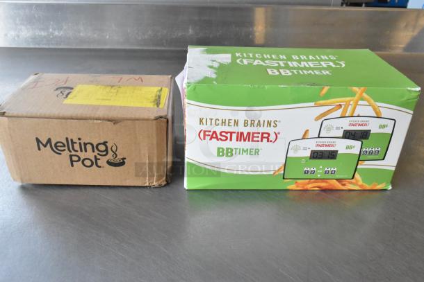 Two brand new items: a Kitchen Brains Fastimer BBTimer in a green box and a Melting Pot in a brown box, both labeled.