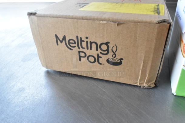 Cardboard box labeled "Melting Pot," appears new with minor dents, part of auction lot including Fastimer Timer.