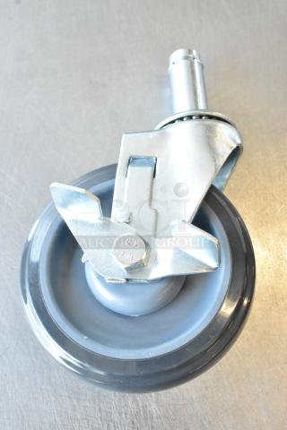 Brand new Regency 5" polyurethane caster with brake, scratch and dent, model 3591201148. Durable equipment stand wheel.