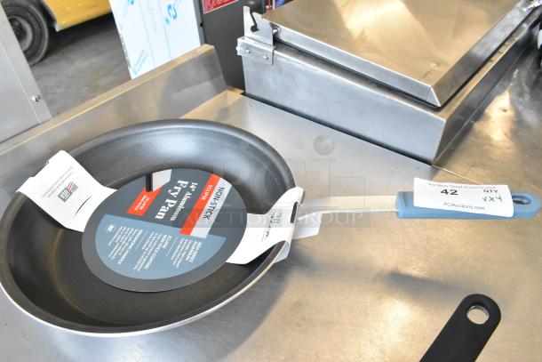 Brand new 14" Vigor A3000 aluminum fry pan with non-stick Eclipse coating and silicone grip, tags visible.