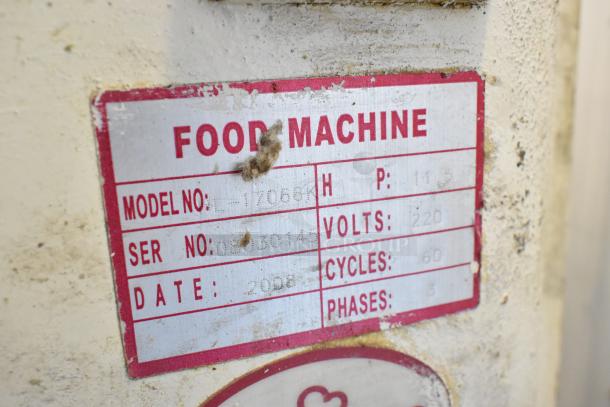 Label on HL-17066-K spiral dough mixer shows model, serial, voltage, and phase details. Some wear is visible on label.