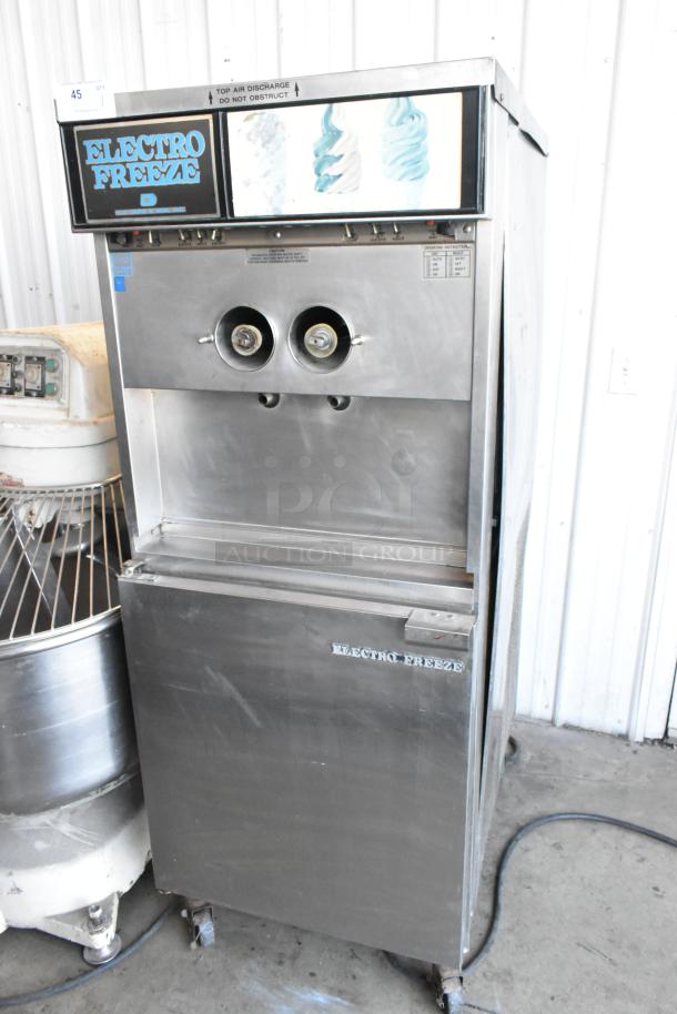 Electro Freeze 30TN-CAB-113 stainless steel 2-flavor soft serve machine on casters, 208/240V, floor style.