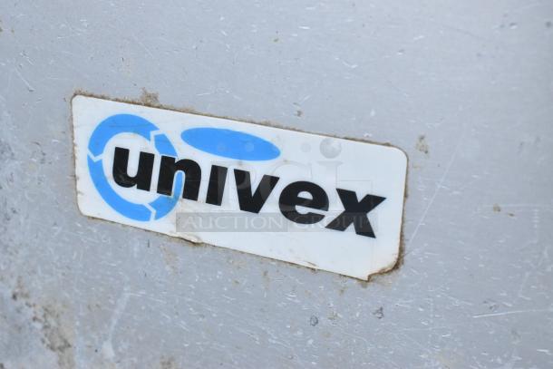 Univex logo on metal Buffalo Chopper indicates brand. Used commercial countertop chopper with S blade functionality.