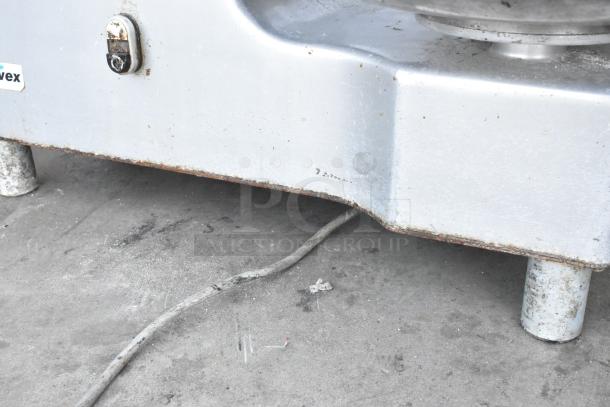 Univex metal commercial countertop Buffalo chopper, visible wear and rust, label indicates Univex brand, features S blade.