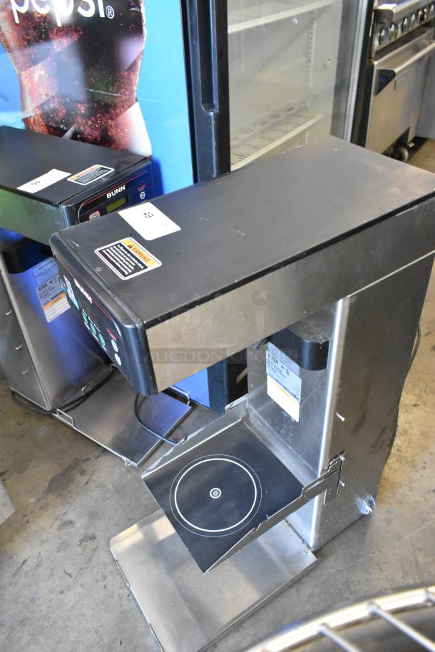 Bunn ITCB-DV stainless steel commercial iced tea machine, countertop model. Visible labels and markings indicate functionality.