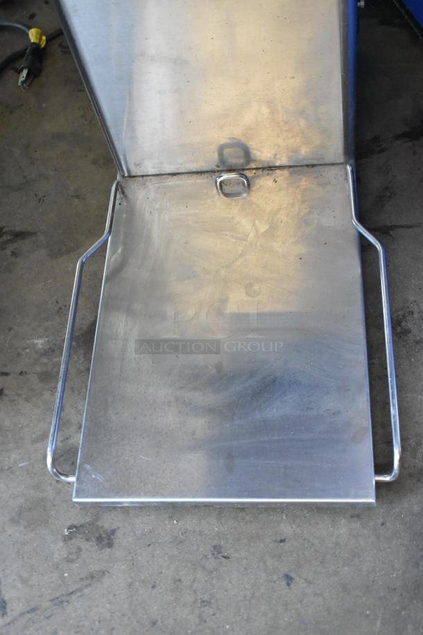 Stainless steel base of Bunn ITCB-DV iced tea machine, showing wear and sturdy construction. Suitable for commercial use.