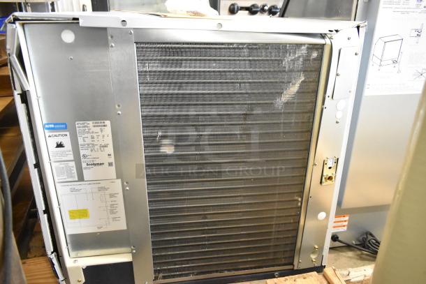 BRAND NEW Scotsman MC1030SA-32A ice machine, minor scratches, 1077 lb. capacity, 208/230V, 1 phase, labels visible.