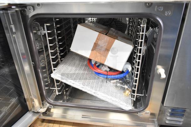 Brand new Blodgett BLCT6E/CSII stainless steel combi convection oven, includes view-through door, metal racks, and stacking kit.