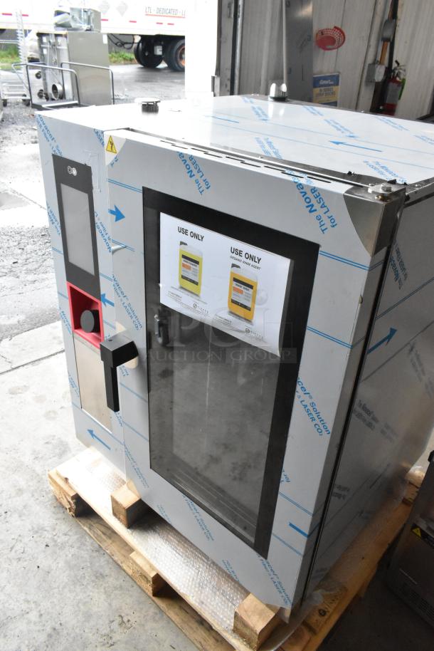 Brand new Blodgett AETE101R stainless steel combi convection oven, 208V, 3-phase, minor scratches, on wooden pallet.
