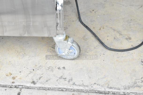 2022 Alto Shaam 1200-UPS stainless steel heated holding cabinet on casters, showing sturdy wheel design.