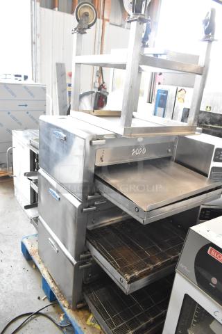 Turbochef HhC2020 stainless steel rapid cook conveyor ovens with stand, 208/240V, 3-phase, on commercial casters.