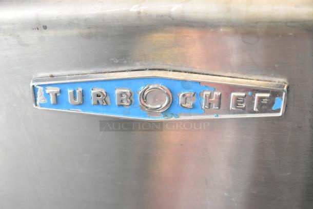 Turbochef HhC2020 stainless steel electric rapid cook conveyor oven with stand. Visible brand logo on the metal surface.