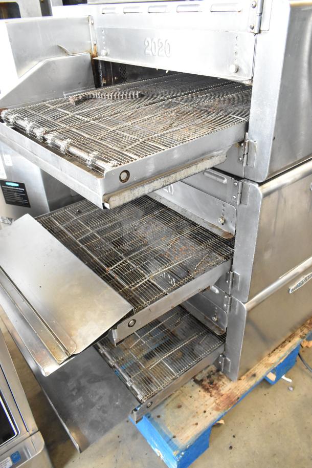 Three Turbochef HhC2020 stainless steel conveyor ovens with stand and commercial casters, electric, 208/240V, 3-phase.