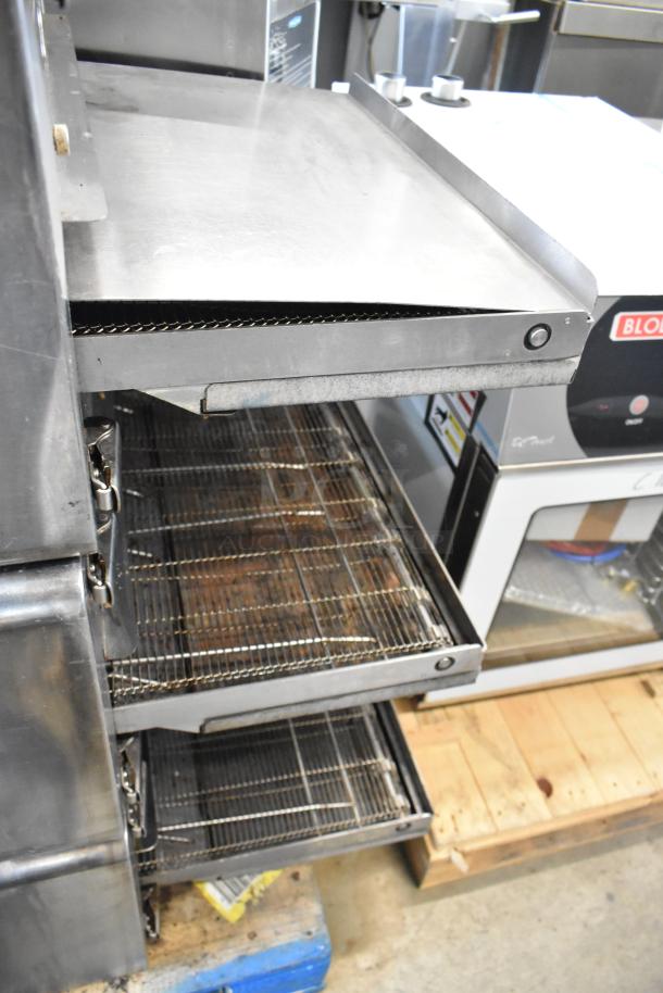 Turbochef HhC2020 stainless steel rapid cook conveyor oven on stand with casters. 208/240V, 3 phase.