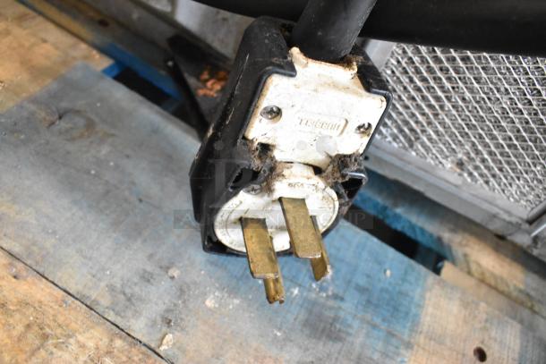 Plug of Turbochef HhC2020 commercial electric conveyor oven, showing wear and standard 208/240V connection.