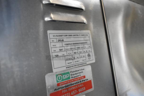 2023 Blodgett DFG-50 stainless steel commercial convection oven, features solid door, metal racks, thermostatic controls, in excellent condition. Includes visible model and gas details on label.