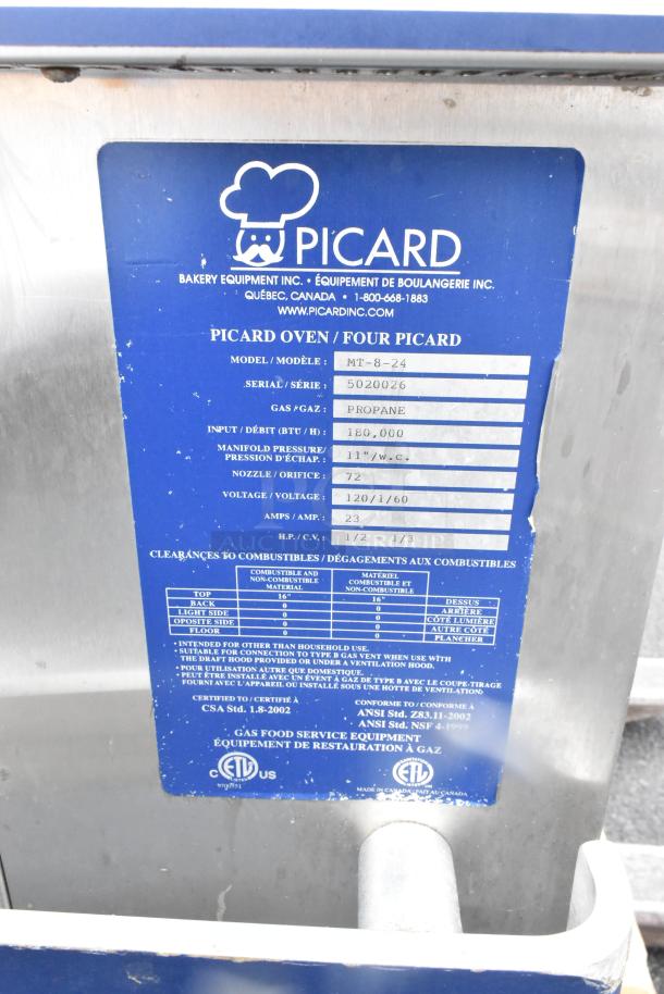 Picard MT-8-24 stainless steel propane revolving tray oven, 180,000 BTU, with hood; model and serial tags visible.
