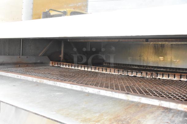 Picard MT-8-24 stainless steel propane gas pan revolving tray oven with hood, 180,000 BTU, commercial floor style.