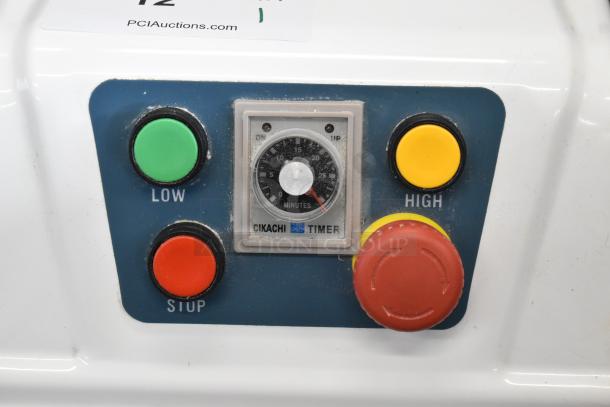 Control panel of Estella 348SM30 dough mixer with buttons for low, high, stop, and timer settings.