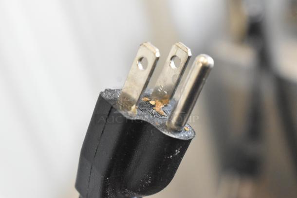 Close-up of a power plug for the Estella 348SM30 spiral dough mixer, showing three prongs.