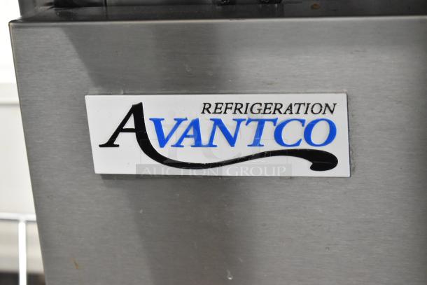 Avantco 178SSPPT2 stainless steel pizza prep table with logo, featuring two drawers, door, shelves, and oversized cutting board.