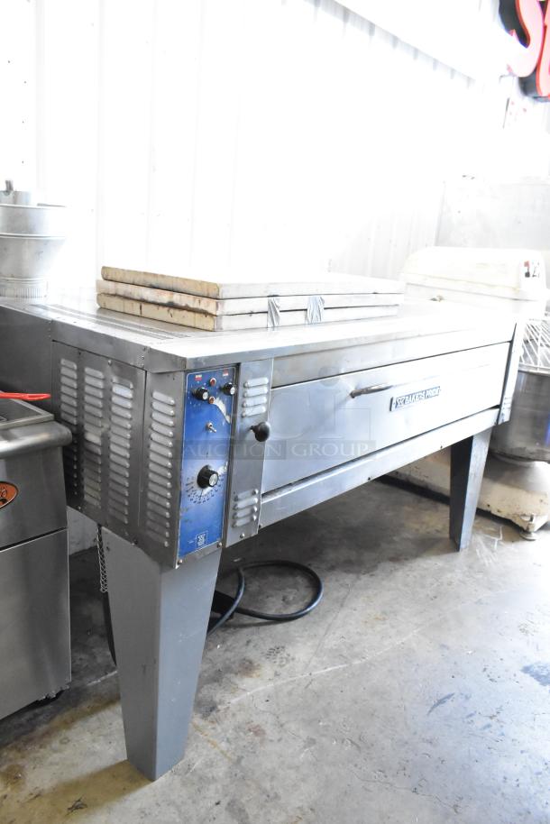 Bakers Pride EP8-5736 stainless steel electric pizza oven with cooking stones, single deck, on metal legs, 208V, 3 phase.