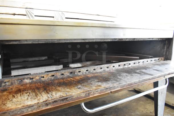 Bakers Pride EP8-5736 stainless steel pizza oven, single deck, cooking stones, 208V, 3-phase, commercial use, metal legs.