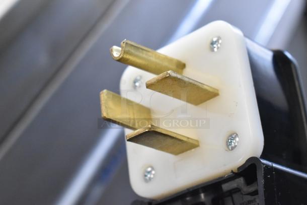Close-up of three-prong plug from Bakers Pride EP8-5736 commercial pizza oven.