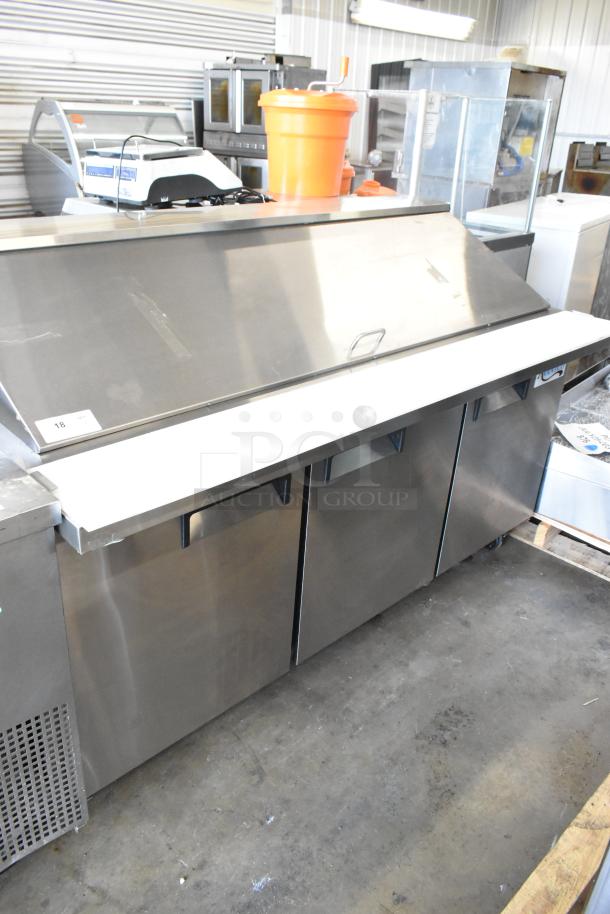 BRAND NEW Avantco 178APT71MHC stainless steel sandwich salad prep table, 115V, with commercial casters, minor dents.