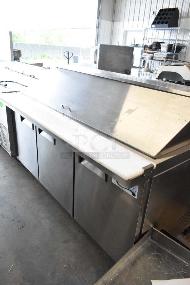 Avantco 178APT71MHC stainless steel sandwich salad prep table, brand new, scratch and dent, on commercial casters, 115V, 1 phase.