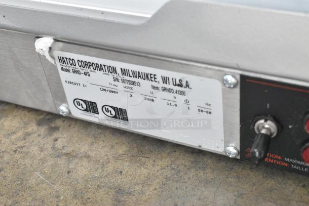 Hatco GRHD-4PD merchandiser label showing model, voltage (120/208V), serial number, and certification marks.