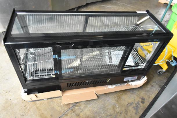 Brand new Avantco 360BCSS48HCB 48" black refrigerated bakery display case with LED lighting, visible minor scratches and dents.