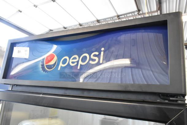 2020 IDW G-26-C-3-3-4-B-5 metal single door reach-in cooler with Pepsi branding and poly-coated racks. 115 volts, 1 phase.