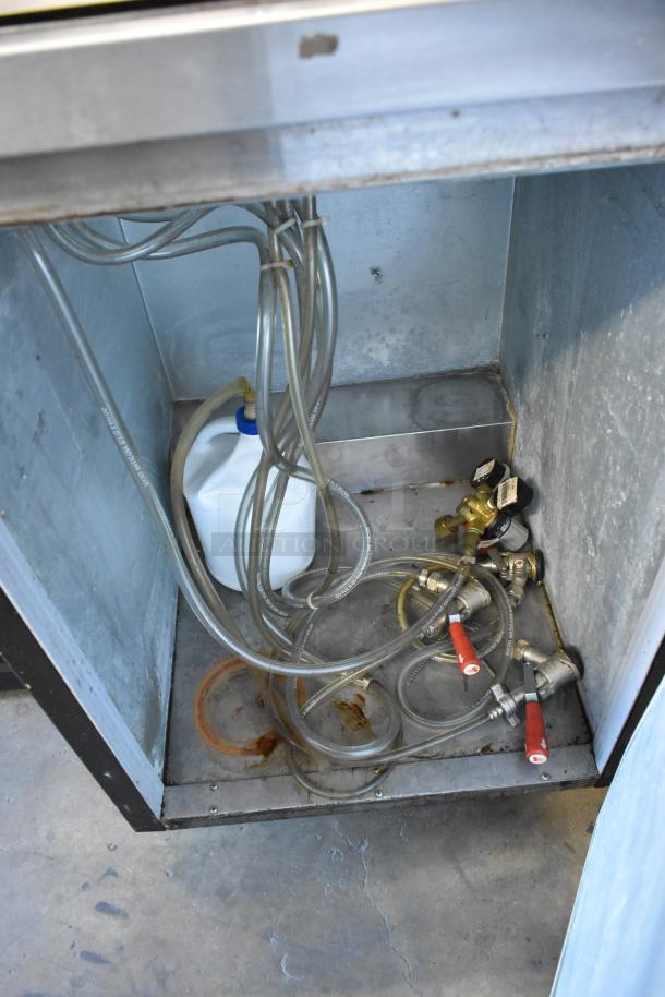 Beverage Air BM23-B kegerator interior showing hoses, couplers, and cleaning solution. Includes commercial casters. 115V, 1 phase.