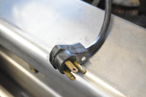 Beverage Air BM23-B kegerator power cord, 115 volts, 1 phase, showing grounded plug connector on stainless steel surface.