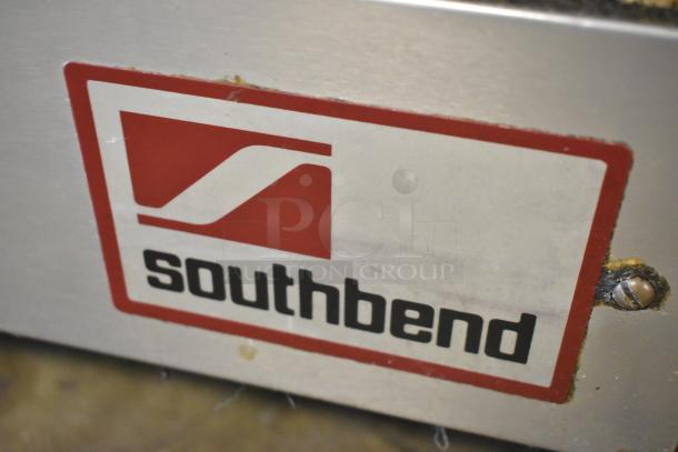 Southbend Stainless Steel Commercial Gas 6 Burner Range with Oven and Backsplash, featuring brand logo tag.