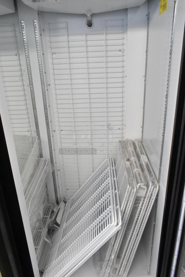 Akita AGF-43-NY 2-door reach-in cooler with poly-coated racks on commercial casters, 115 volts, 1 phase, excellent condition.