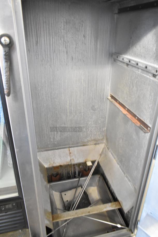Town SM-24-R-SS-P commercial stainless steel smoker, propane gas, upright design, interior shown, good condition.