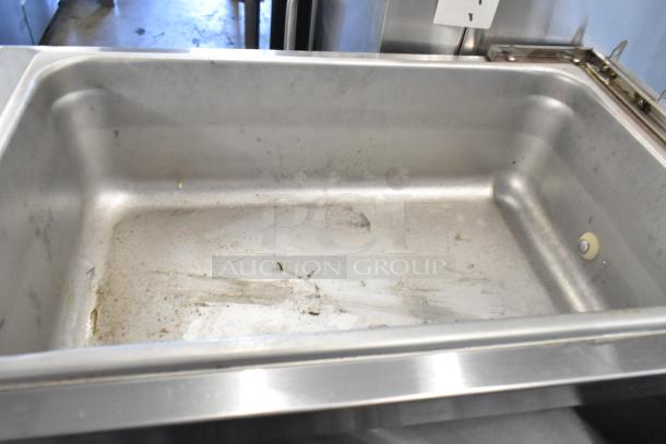 Duke Electro Freeze 145-214 slushie machine interior, stainless steel, visible wear, set on commercial casters, 115V, 1 phase.
