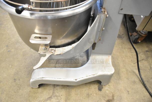 2019 Omcan SP200A 20 Quart planetary dough mixer with stainless steel bowl, bowl guard, and whisk attachment. Visible wear on base.